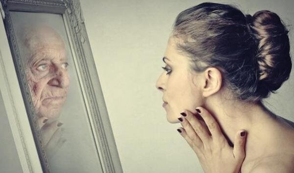 Woman-looking-at-mirror-representing-Dorian-Gray-s Woman-looking-at-mirror-representing-Dorian-Gray-s